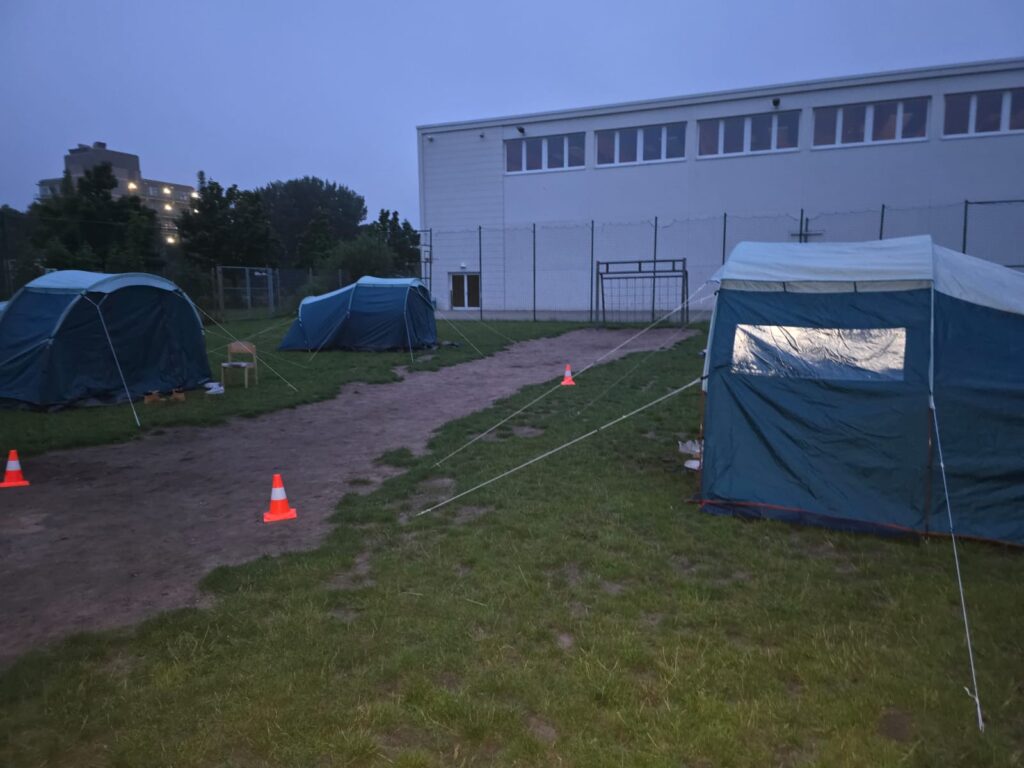 Tents set up on the camp field at dusk