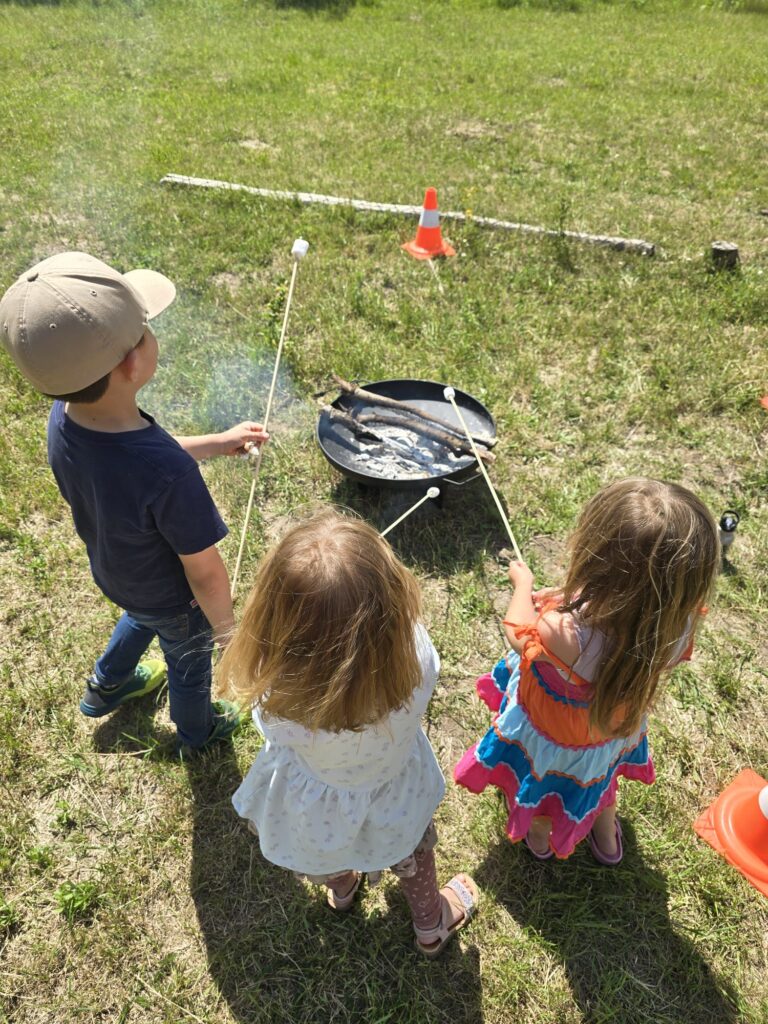 Campers gathered around the fire pit